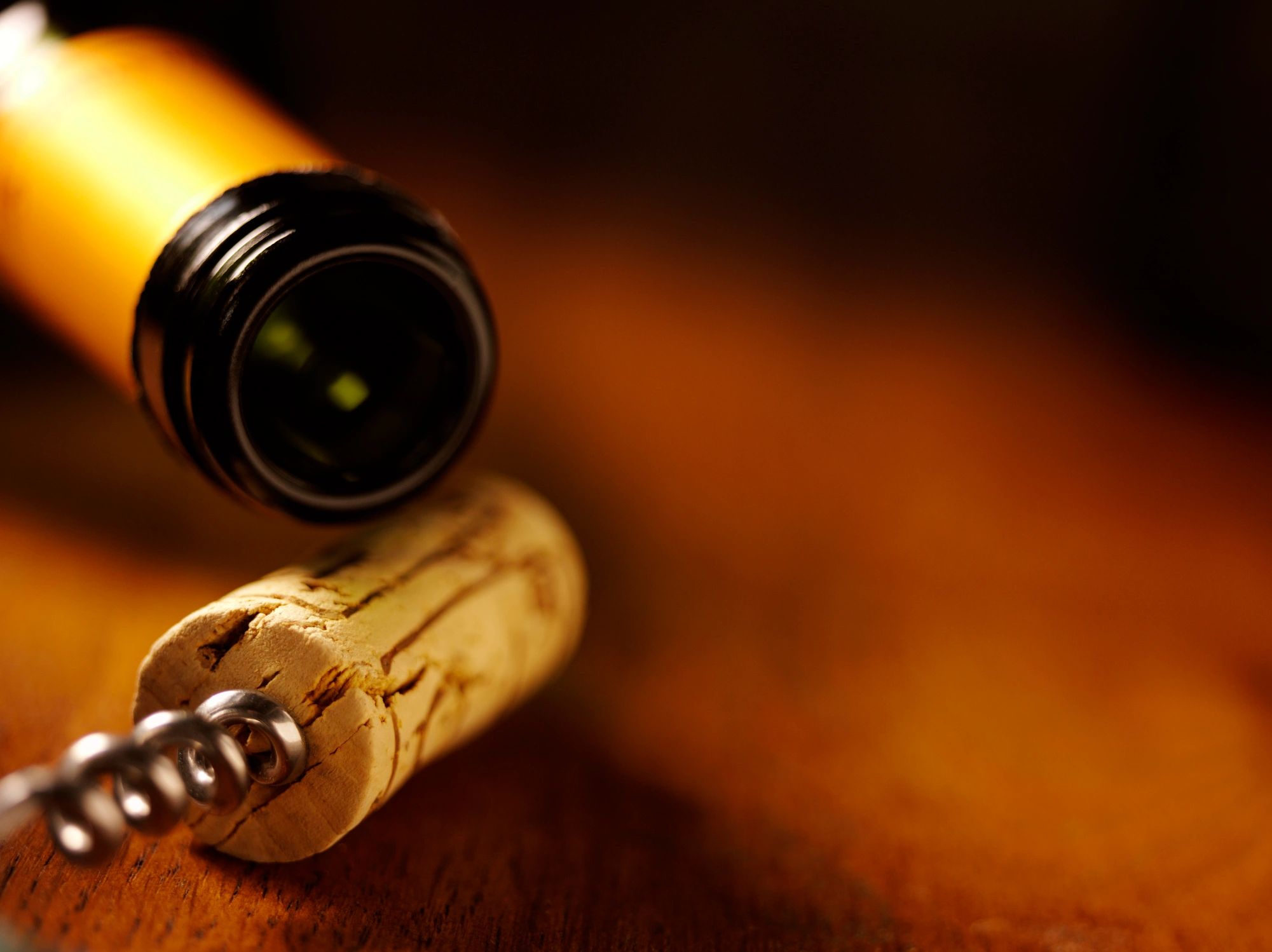 Wine bottle and corks arranged on a table for craft inspiration