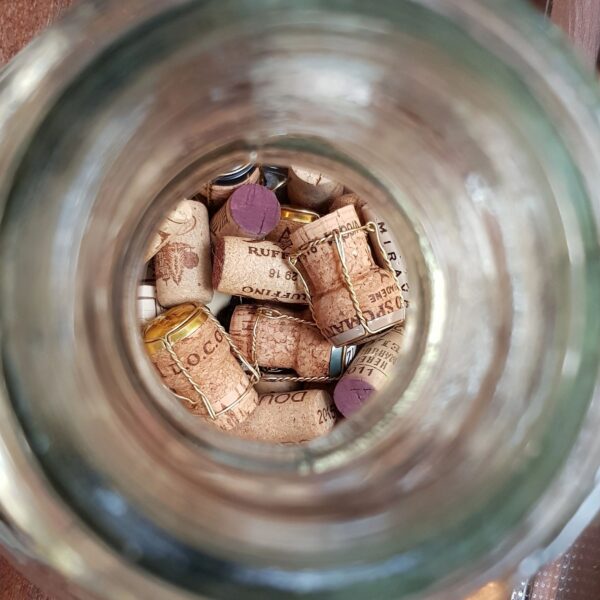 Wine corks through glass bottleneck closeup
